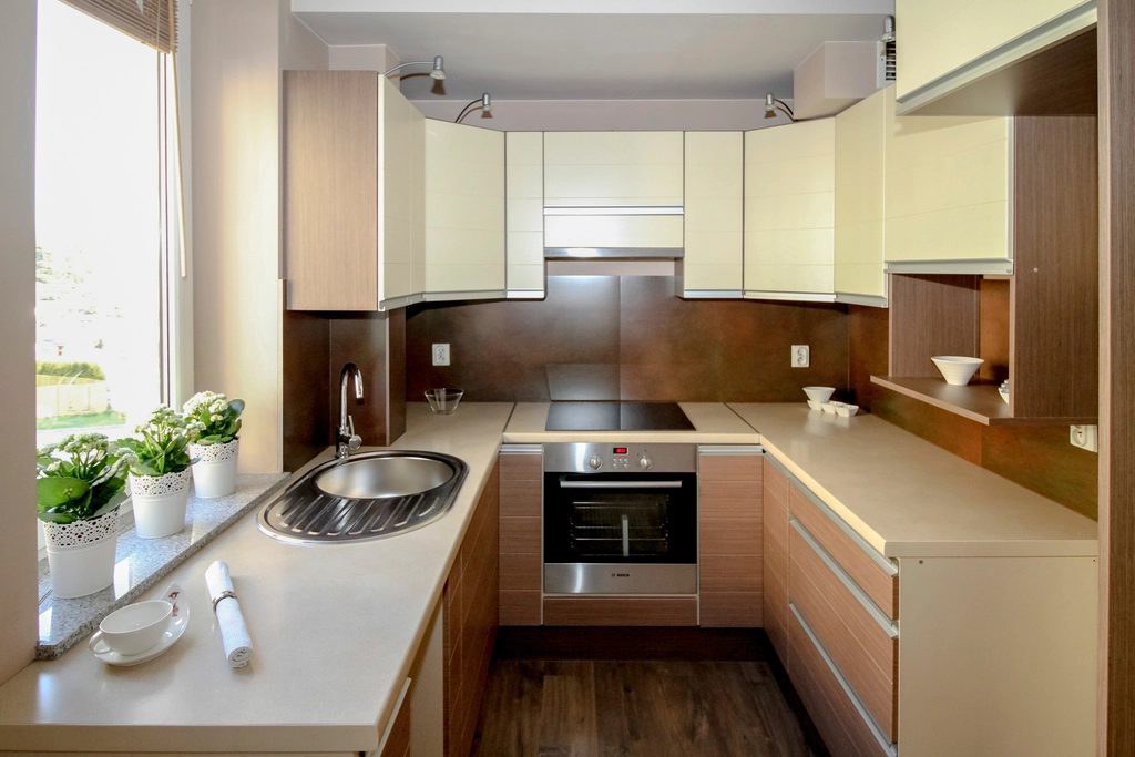 Compact condo kitchen with wood cabinets